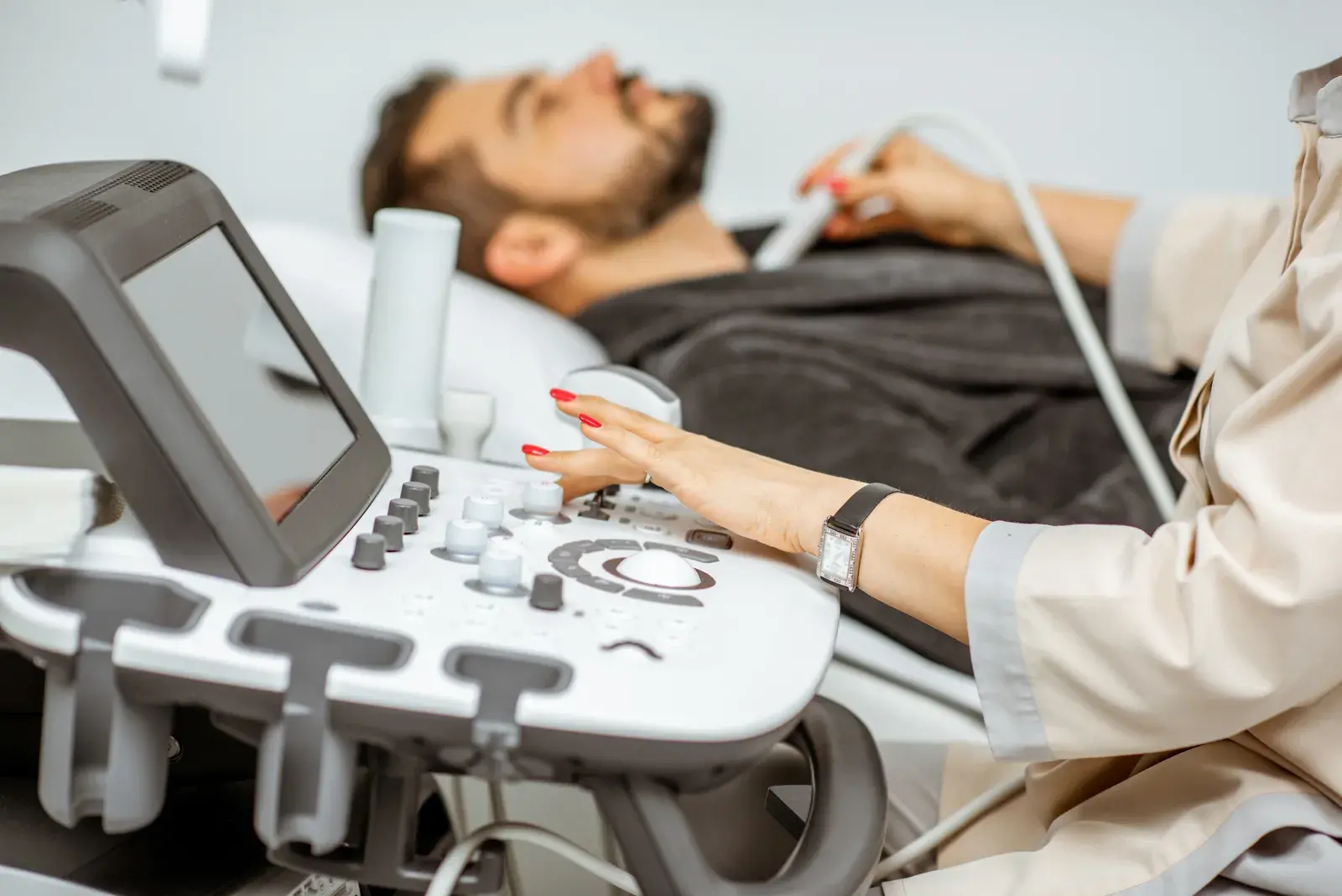 men-examining-his-thyroid-with-ultrasound-2023-11-27-04-50-53-utc